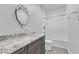 Bathroom with granite countertop, gray vanity, and shower/tub combo at 1100 Branch Chapel Church Rd, Selma, NC 27576