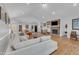 Spacious living room with hardwood floors, vaulted ceiling, and fireplace at 1100 Branch Chapel Church Rd, Selma, NC 27576