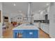 Open concept kitchen with island, stainless steel appliances, and hardwood floors at 1100 Branch Chapel Church Rd, Selma, NC 27576