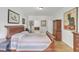Bright bedroom with hardwood floors and built-in armoire at 1100 Branch Chapel Church Rd, Selma, NC 27576