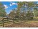 View of the backyard with wooden fence at 1100 Branch Chapel Church Rd, Selma, NC 27576
