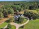 Aerial view of a house on a spacious lot with a long driveway at 1100 Branch Chapel Church Rd, Selma, NC 27576