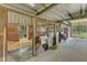 Clean and functional barn stalls with wood doors at 1100 Branch Chapel Church Rd, Selma, NC 27576