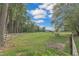 White horse in a pasture with wooden fence and barn at 1100 Branch Chapel Church Rd, Selma, NC 27576
