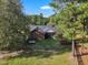 Back of house showing a screened porch, large yard, and wooden fence at 1100 Branch Chapel Church Rd, Selma, NC 27576