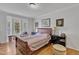Spacious bedroom with hardwood floors and large window at 1100 Branch Chapel Church Rd, Selma, NC 27576