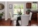 Kitchen dining area with glass table and chairs at 700 Quail Ct, Creedmoor, NC 27522