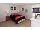 Bright bedroom with a queen-size bed and stylish decor at 700 Quail Ct, Creedmoor, NC 27522