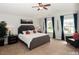 Spacious main bedroom with a king-size bed and large windows at 700 Quail Ct, Creedmoor, NC 27522