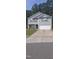 Gray two story house with double garage and stone accents at 700 Quail Ct, Creedmoor, NC 27522