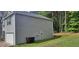 Gray two story house with a white garage door at 700 Quail Ct, Creedmoor, NC 27522