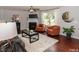 Living room with fireplace and hardwood floors at 700 Quail Ct, Creedmoor, NC 27522