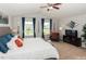 Spacious main bedroom with a king-size bed and large windows at 700 Quail Ct, Creedmoor, NC 27522