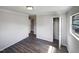 Bedroom with large closet and wood-look floors at 225 W Orange St, Hillsborough, NC 27278