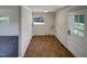 Bright laundry room with tile floor, exterior access, and space for washer and dryer at 225 W Orange St, Hillsborough, NC 27278