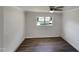 Bright bedroom with wood-look flooring and ceiling fan at 225 W Orange St, Hillsborough, NC 27278
