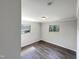 Spacious bedroom with two windows and wood-look floors at 225 W Orange St, Hillsborough, NC 27278