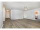 Open living room with wood-look flooring and access to the front entryway at 108 Hiddenwood Ct, Garner, NC 27529