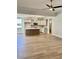 Open kitchen with island and stainless steel appliances at 15 Bella Ln, Zebulon, NC 27597