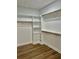 Large walk-in closet with ample shelving and hanging space at 15 Bella Ln, Zebulon, NC 27597