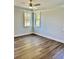 Bright bedroom with two windows and ceiling fan at 15 Bella Ln, Zebulon, NC 27597