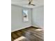 Spacious bedroom with large window and ceiling fan at 15 Bella Ln, Zebulon, NC 27597