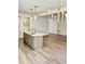 Kitchen island with quartz countertop and sink at 15 Bella Ln, Zebulon, NC 27597