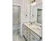 Double vanity bathroom with marble flooring and a shower at 15 Bella Ln, Zebulon, NC 27597
