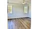 Bright bedroom with two windows and ceiling fan at 15 Bella Ln, Zebulon, NC 27597