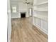 Spacious living room with fireplace and wood-look flooring at 15 Bella Ln, Zebulon, NC 27597