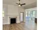 Open living room with fireplace and access to backyard at 15 Bella Ln, Zebulon, NC 27597