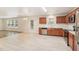 Modern kitchen with stainless steel appliances and light wood cabinets at 817 Leatherstone Ln, Fuquay Varina, NC 27526