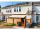 View of the back of the house, with a patio, fence, and lawn at 311 Walnut Woods Dr, Morrisville, NC 27560