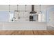 Modern kitchen island with white cabinets and quartz countertops at 2804 Jack Mitchell Rd, Zebulon, NC 27597