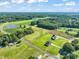 Aerial view of property showing home, pond, and farmland at 2804 Jack Mitchell Rd, Zebulon, NC 27597