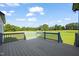Deck overlooking a lush green field and trees at 2804 Jack Mitchell Rd, Zebulon, NC 27597