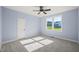 Bedroom with carpet flooring, ceiling fan, and a view of the backyard at 2804 Jack Mitchell Rd, Zebulon, NC 27597