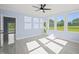 Sunroom with light blue walls, hardwood floors, and multiple windows at 2804 Jack Mitchell Rd, Zebulon, NC 27597