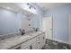 Bathroom with granite countertop, double sinks, and shower at 2804 Jack Mitchell Rd, Zebulon, NC 27597