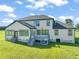 Two story house with gray siding, gray deck and green lawn at 2804 Jack Mitchell Rd, Zebulon, NC 27597