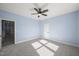 Bedroom with carpet flooring, ceiling fan, and access to another room at 2804 Jack Mitchell Rd, Zebulon, NC 27597