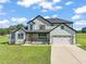 Modern farmhouse exterior with two-car garage at 2804 Jack Mitchell Rd, Zebulon, NC 27597