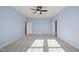 Spacious bedroom with grey carpet and two doors at 2804 Jack Mitchell Rd, Zebulon, NC 27597