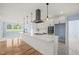 Modern kitchen with white cabinets, stainless steel appliances, and an island at 2804 Jack Mitchell Rd, Zebulon, NC 27597