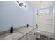 Bathroom with double vanity, granite countertop, and a bathtub shower combo at 2804 Jack Mitchell Rd, Zebulon, NC 27597