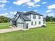 Two story house exterior with gray siding and green lawn at 2804 Jack Mitchell Rd, Zebulon, NC 27597