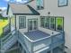 Elevated deck with gray flooring and stairs at 2804 Jack Mitchell Rd, Zebulon, NC 27597