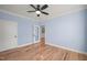 Simple bedroom with hardwood floors and ceiling fan at 2804 Jack Mitchell Rd, Zebulon, NC 27597