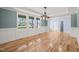 Spacious dining room featuring hardwood floors and wainscoting at 2804 Jack Mitchell Rd, Zebulon, NC 27597