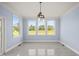 Bright dining room with large windows and a chandelier at 2804 Jack Mitchell Rd, Zebulon, NC 27597